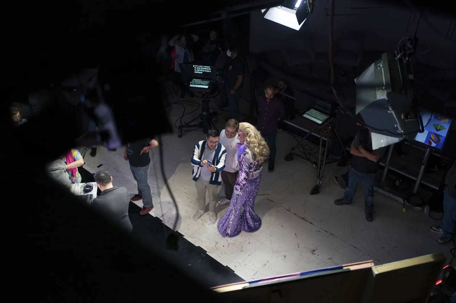 Drag news anchor Amanda, right, talks with producers during the pre-taping of her news program “La Verdrag”, on the studio floor of Canal Once, in Mexico City, Wednesday, Oct. 11, 2023. (AP Photo/Aurea Del Rosario)